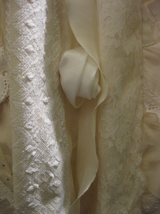 Detail with vintage lace, fabric and a trapunto (Italian quilting) leaf, just seen in lower right corner.